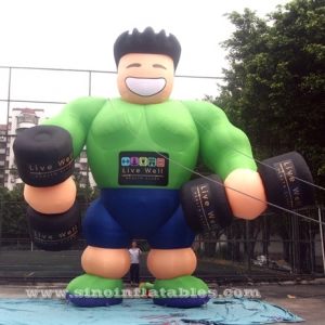 hombre musculoso inflable gigante verde fitness