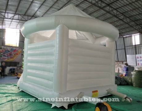 adults wedding all white bouncy castle with Rose decoration